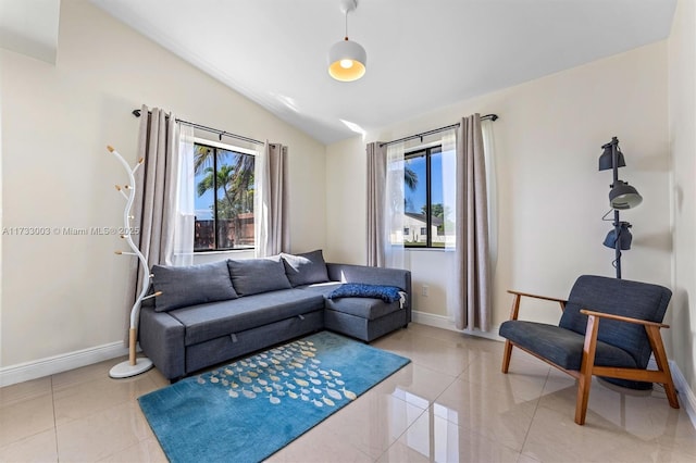 living room featuring light tile patterned flooring and lofted ceiling