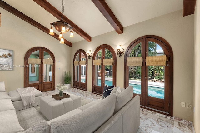 living area with marble finish floor, vaulted ceiling with beams, and french doors