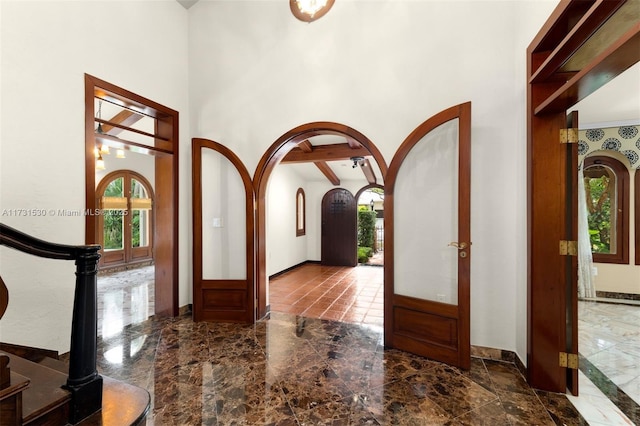 225 Alesio Ave, Coral Gables, FL 33134 - entryway with arched walkways, stairs, a high ceiling, and marble finish floor