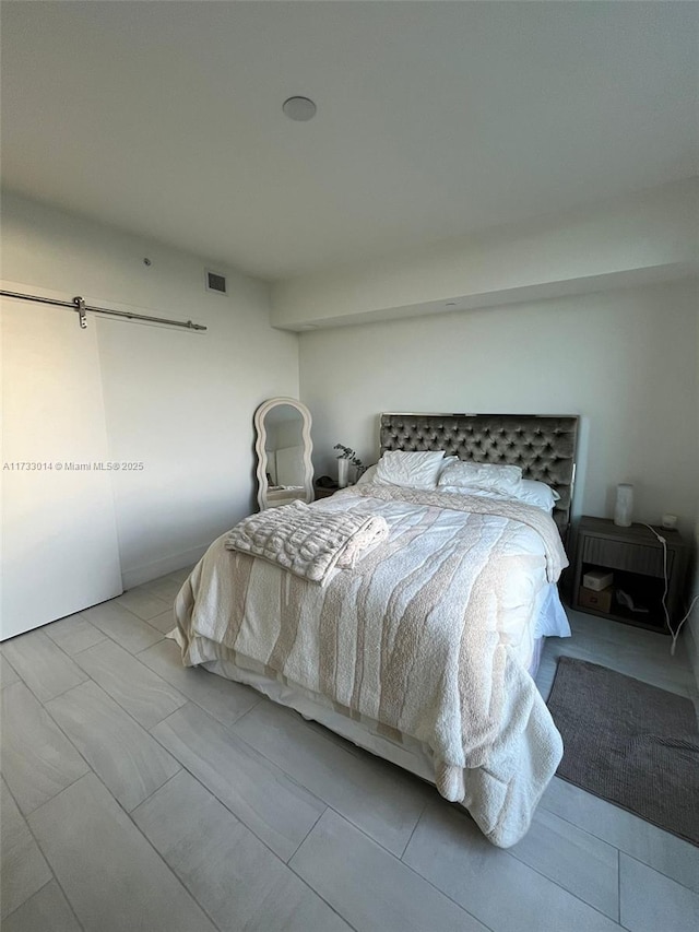 bedroom with a barn door