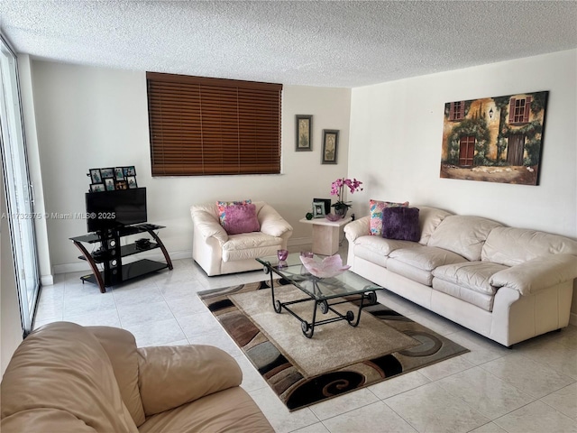 living room with light tile patterned floors and a textured ceiling