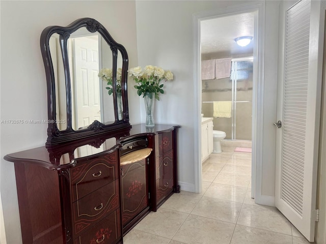 hallway featuring light tile patterned floors