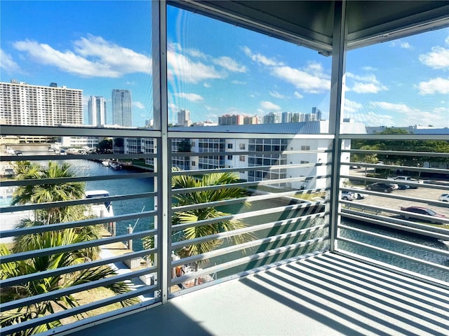 balcony featuring a water view