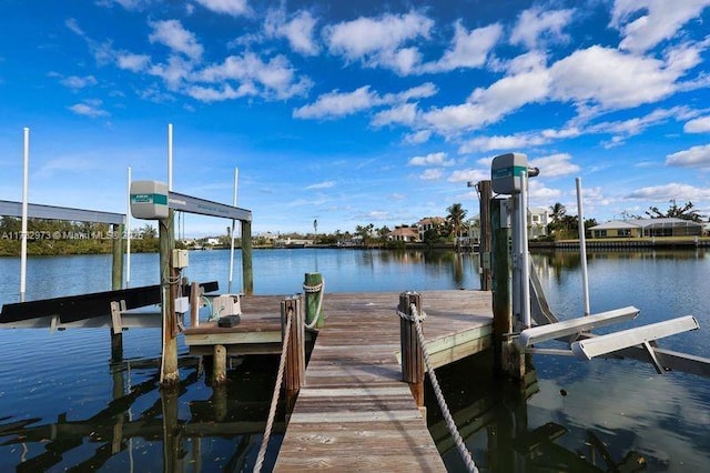 view of dock with a water view and boat lift