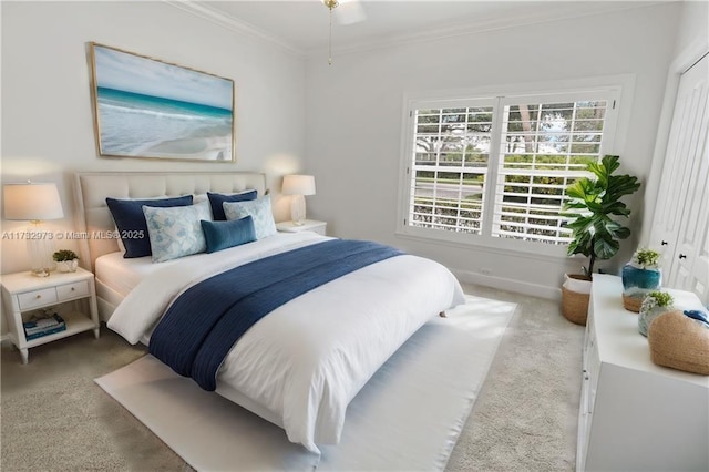 bedroom featuring ornamental molding, carpet flooring, and baseboards