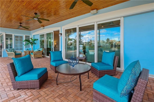 view of patio featuring a ceiling fan and an outdoor living space