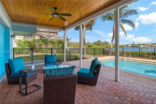 view of patio / terrace featuring outdoor lounge area, a fenced backyard, a ceiling fan, and a fenced in pool