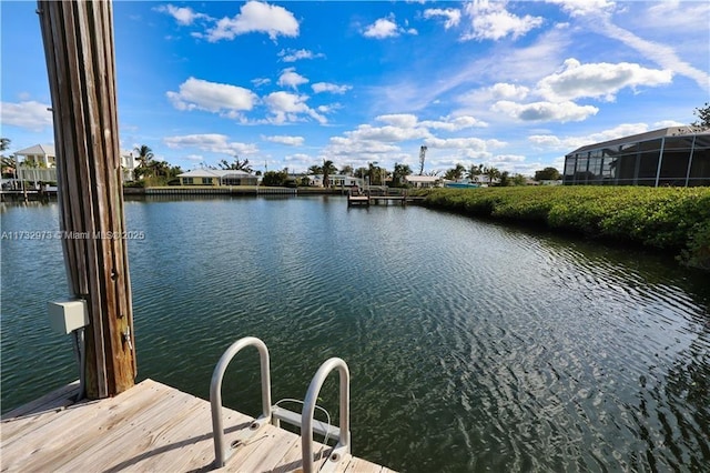 dock area with a water view