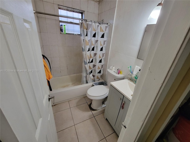 full bathroom with shower / bath combination with curtain, vanity, tile patterned floors, and toilet