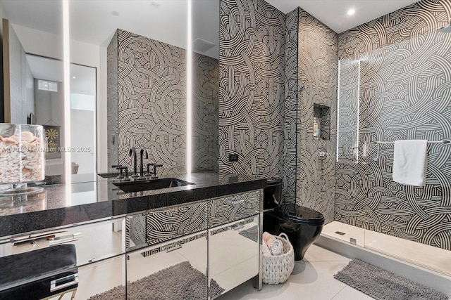 bathroom with tile patterned flooring, a shower, vanity, and toilet