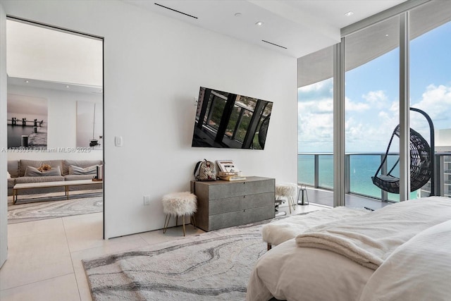 tiled bedroom with floor to ceiling windows, access to exterior, and multiple windows