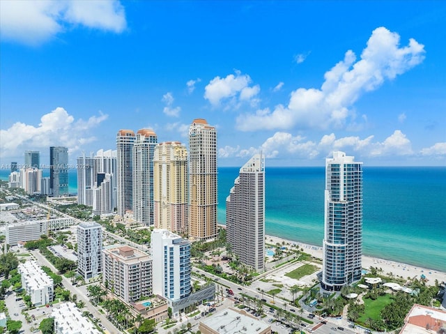 aerial view featuring a view of the beach and a water view