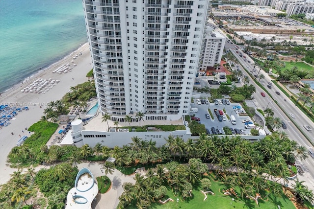 aerial view featuring a view of the beach and a water view