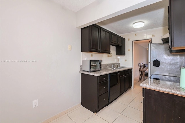 kitchen featuring sink, black dishwasher, extractor fan, and light tile patterned floors