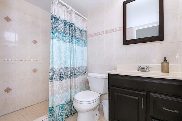 bathroom featuring vanity, toilet, tile walls, and a shower with curtain