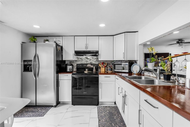 kitchen with white cabinetry, ceiling fan, appliances with stainless steel finishes, and sink