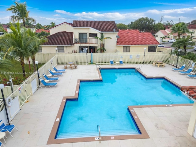 view of swimming pool featuring a patio