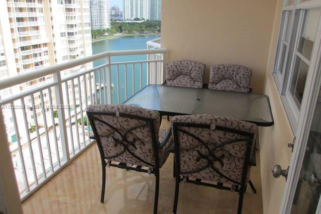 balcony featuring a water view