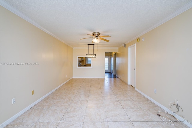 spare room with ceiling fan, ornamental molding, and a textured ceiling