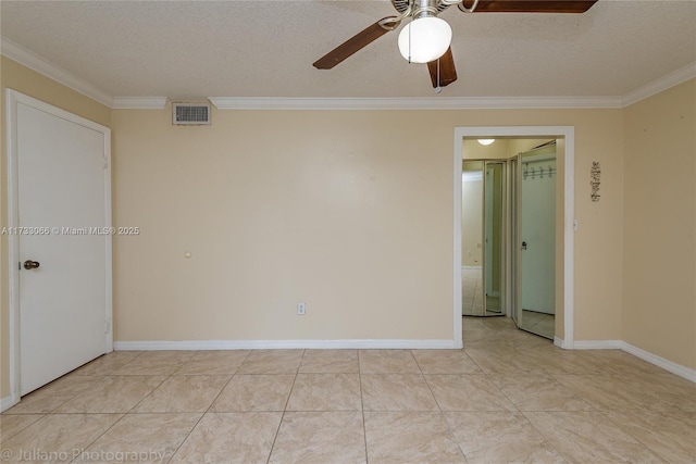 unfurnished room featuring ornamental molding, light tile patterned flooring, ceiling fan, and a textured ceiling