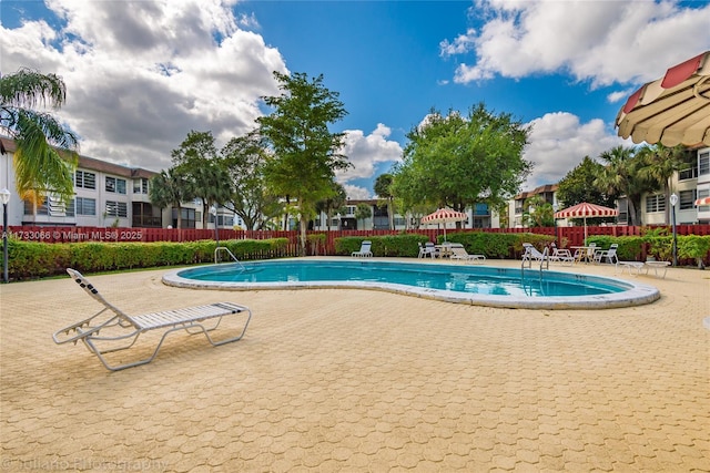 view of swimming pool featuring a patio