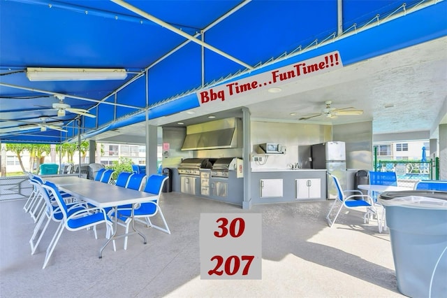 view of patio with a grill and an outdoor kitchen