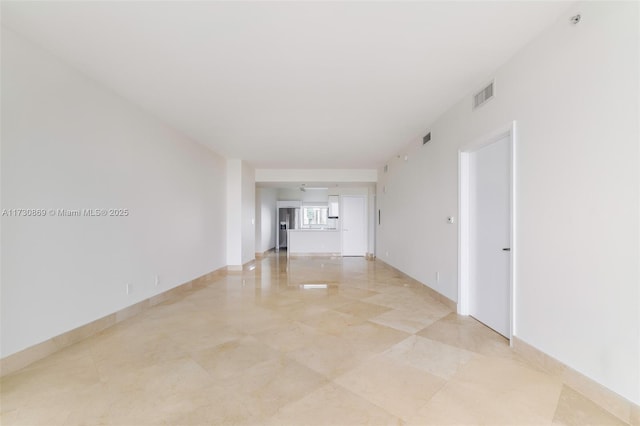 unfurnished room featuring visible vents