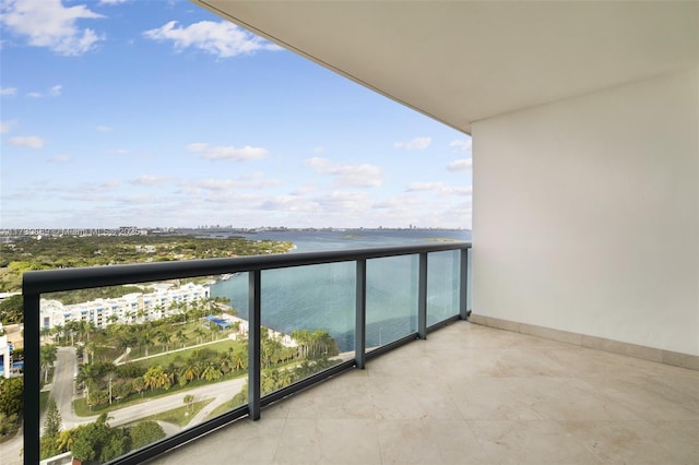 balcony featuring a water view