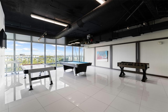 recreation room with a wall of windows, tile patterned flooring, and pool table