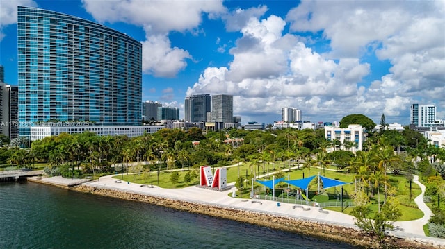 exterior space with a city view and a water view