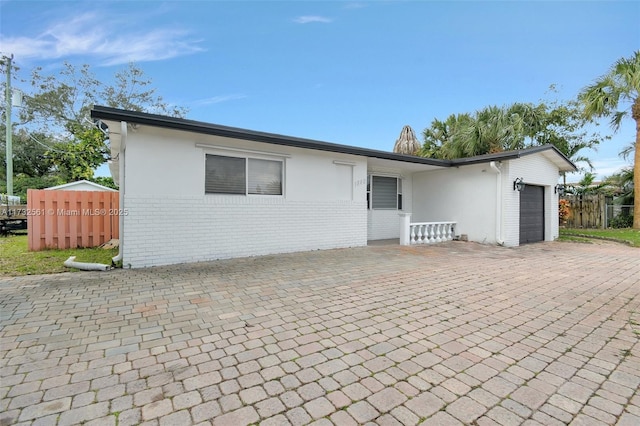 single story home with a garage