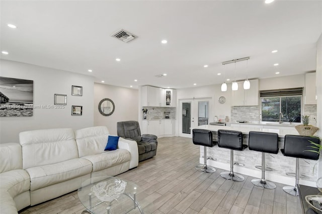 living room with light hardwood / wood-style floors