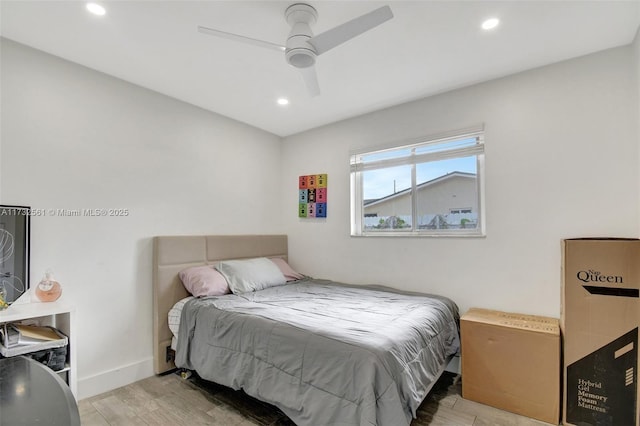 bedroom featuring ceiling fan and light hardwood / wood-style flooring