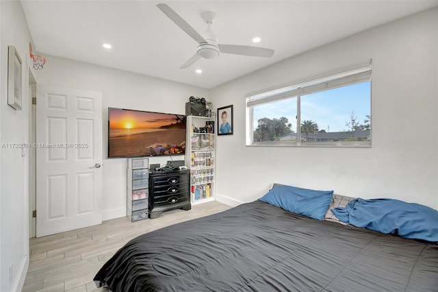 bedroom featuring light wood-type flooring and ceiling fan