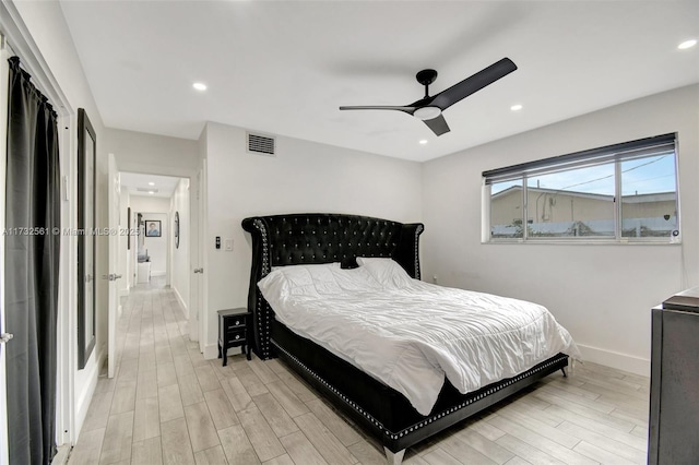 bedroom featuring ceiling fan and light hardwood / wood-style flooring