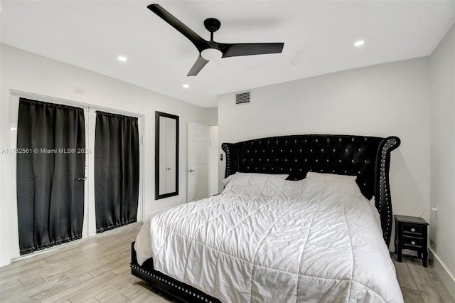 bedroom with light hardwood / wood-style flooring and ceiling fan