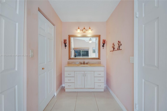 bathroom featuring tile patterned flooring and vanity