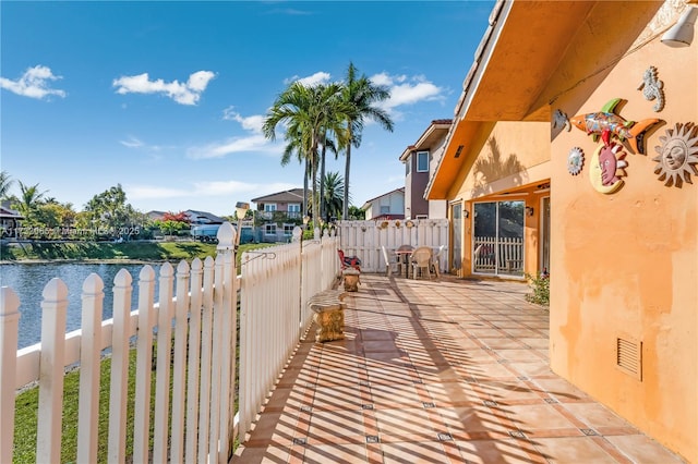 view of patio / terrace featuring a water view