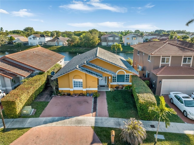 birds eye view of property featuring a water view