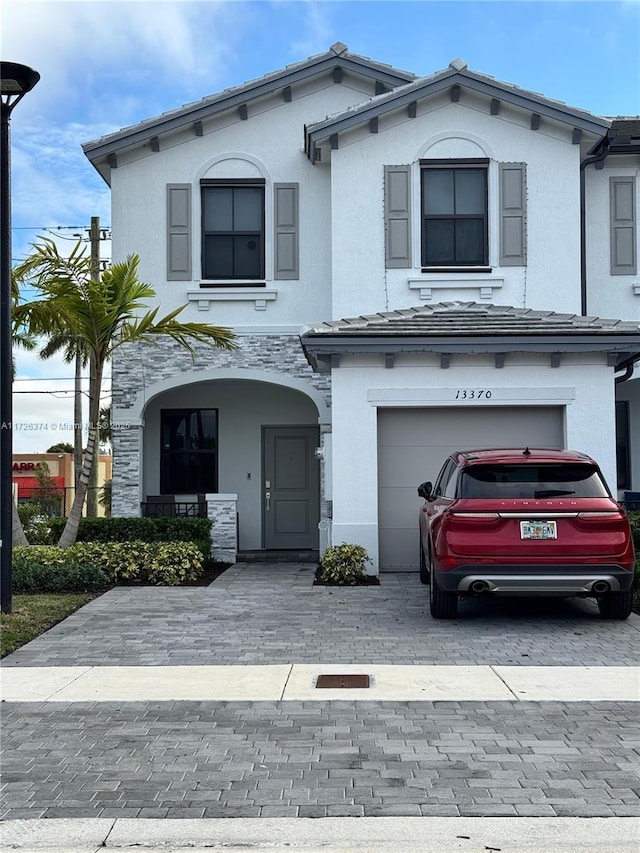 view of front of property with a garage