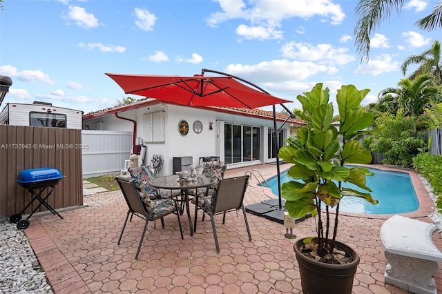 view of patio featuring a fenced in pool