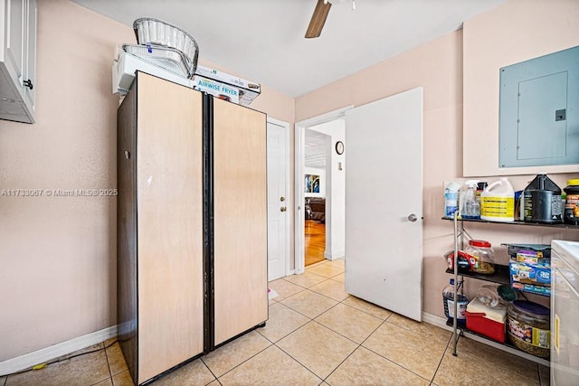 interior space with electric panel and light tile patterned floors