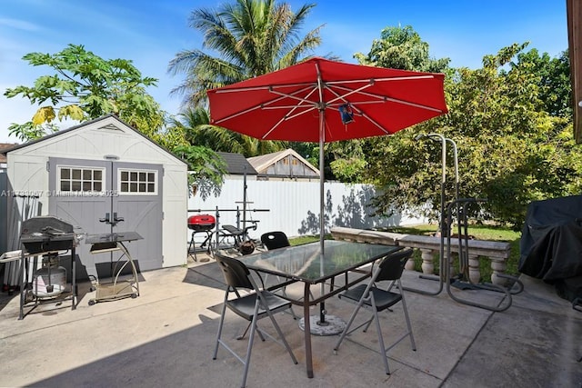 view of patio featuring a shed and grilling area