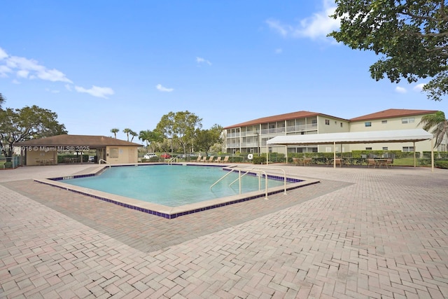 view of swimming pool with a patio