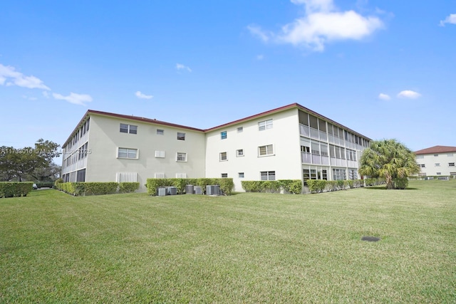 view of building exterior with central air condition unit