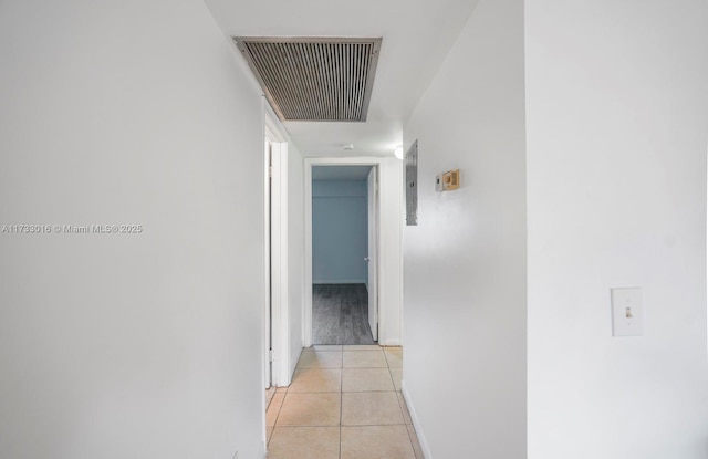 hallway featuring light tile patterned floors