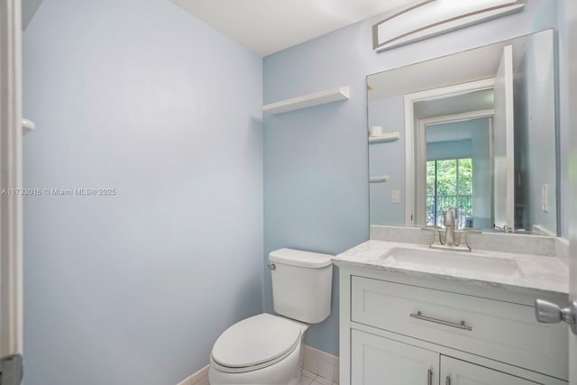 bathroom featuring vanity and toilet