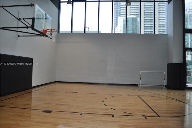 view of basketball court featuring plenty of natural light