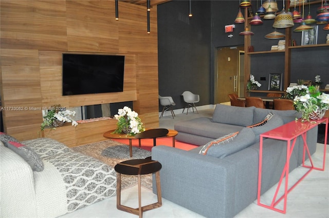 living room featuring wooden walls