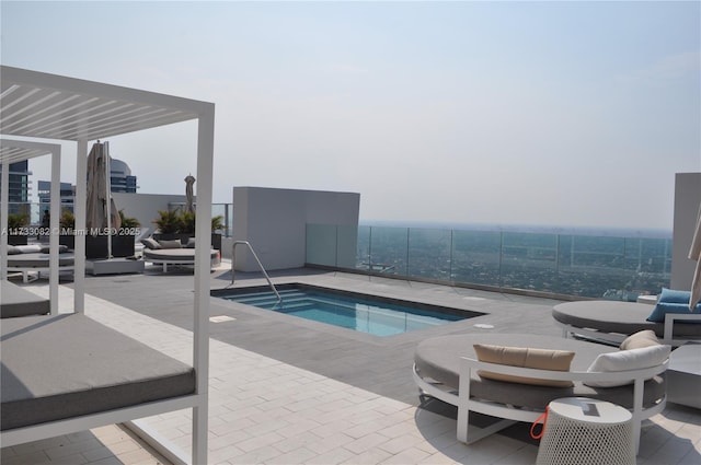 view of pool featuring a hot tub, an outdoor hangout area, and a patio area